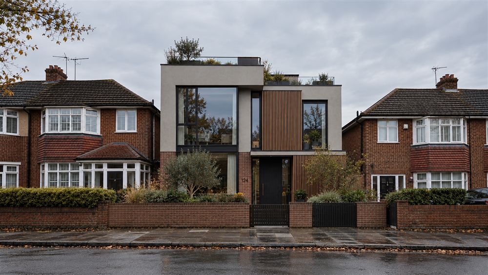 No.124 House: a brick, render and timber family house with a planted roof on a suburban street