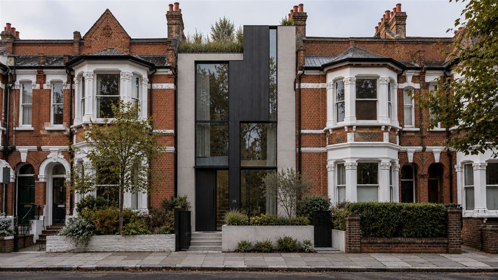 No.28 Townhouse: a slim dark-clad townhouse inserted between Victorian brick houses