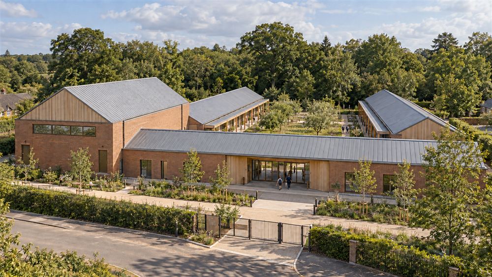 The Orchard School: a single-storey brick and timber primary school with zinc roofs around an orchard garden in Surrey